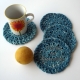 Set of 4 crocheted teal cotton coasters