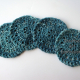 Set of 4 crocheted teal cotton coasters