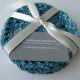 Set of 4 crocheted teal cotton coasters