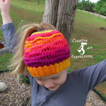 Crocheted Sunset Sea Messy Bun Sea Breeze Hat, Child Size 2-5 years, Sea Breeze Collection, Mermaid Fashion, Unique Gifts, Handmade winter hat, Handmade Ponytail Hat, Mermaid at Heart, Ocean Crochet, Coastal Crochet, Crochet with Meaning